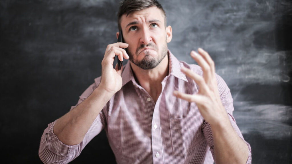 Person waiting on hold on the phone