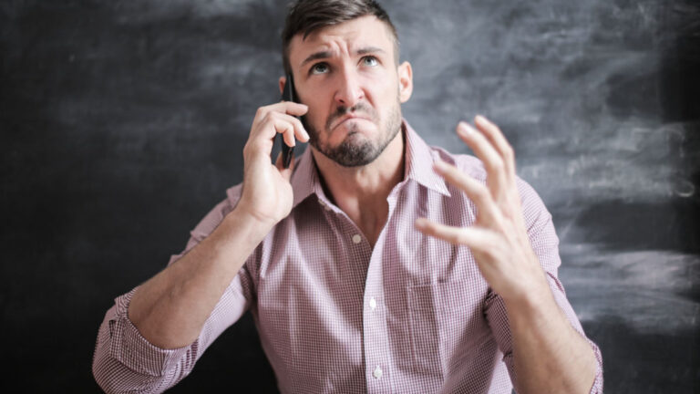 Person waiting on hold on the phone