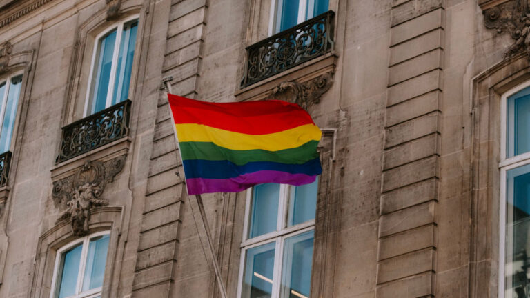 Diverse and inclusive community gathering showing LGBTQI+ pride and support
