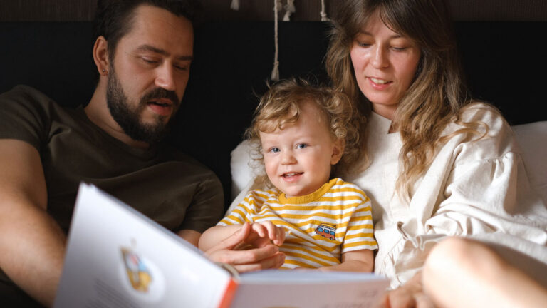 Child learning at home with a parent