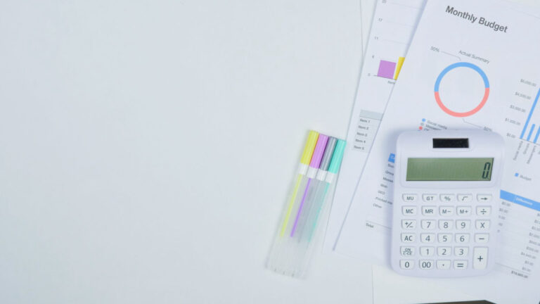 Budget planning with calculator and documents