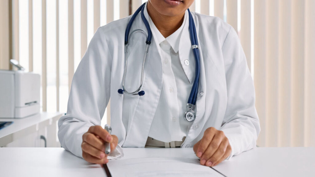 Medical professional writing clinical notes