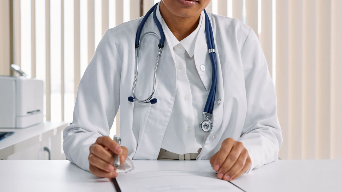 Medical professional writing clinical notes