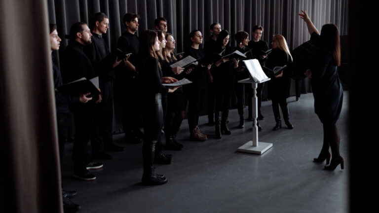 Person singing joyfully in a music setting