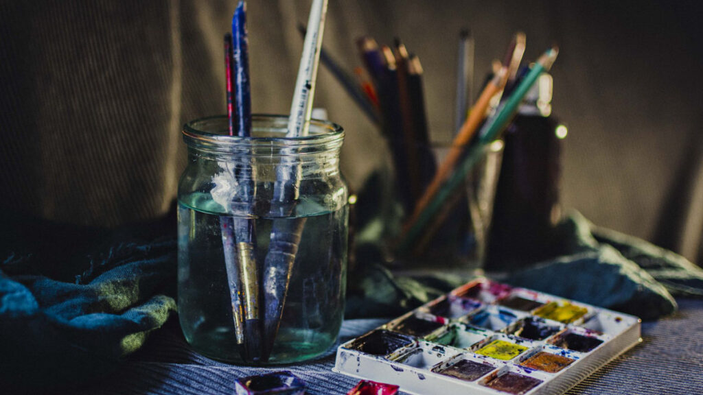 Colorful art studio with paints and brushes