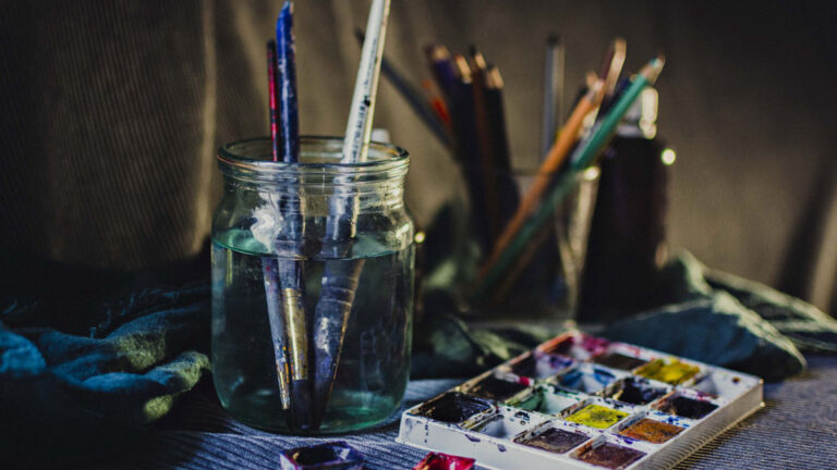 Colorful art studio with paints and brushes
