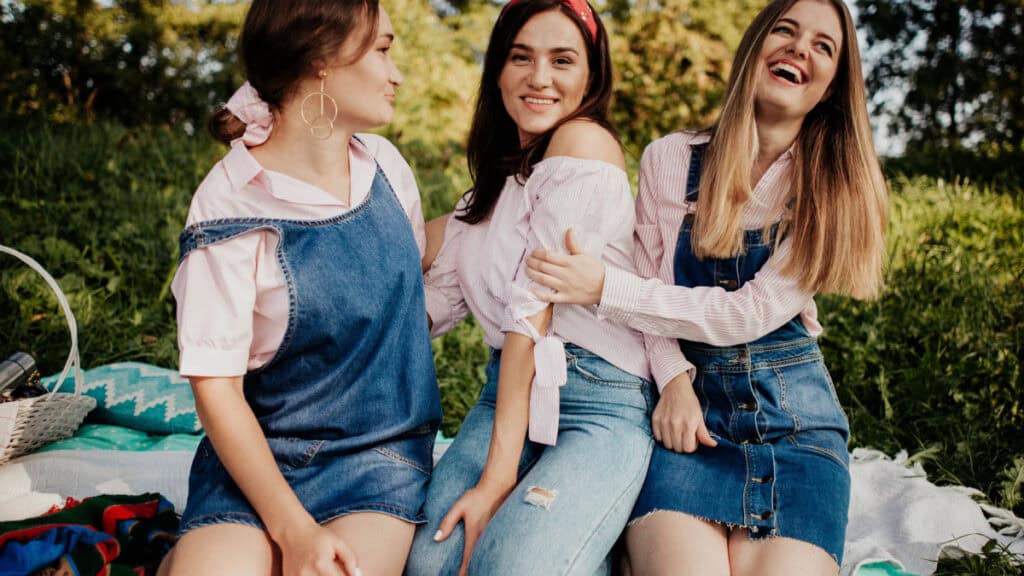 Friends laughing and having fun in a sunny park